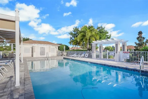 a view of a swimming pool with a patio