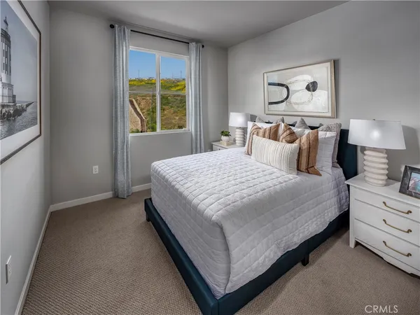 a bedroom with a bed and window