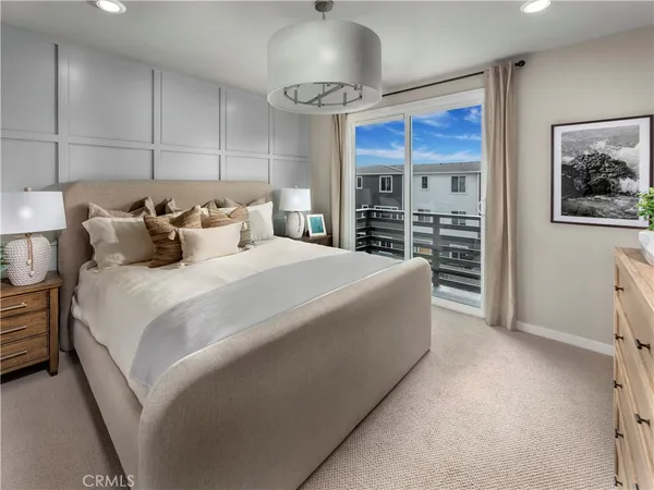 a bed room with a bed and a ceiling fan