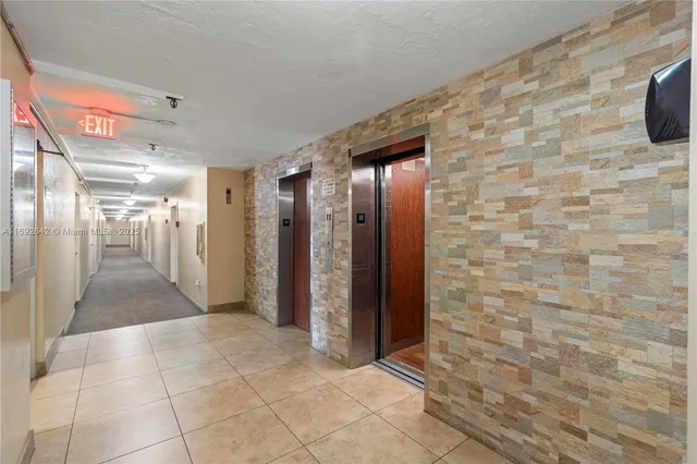 a bathroom with a glass door shower