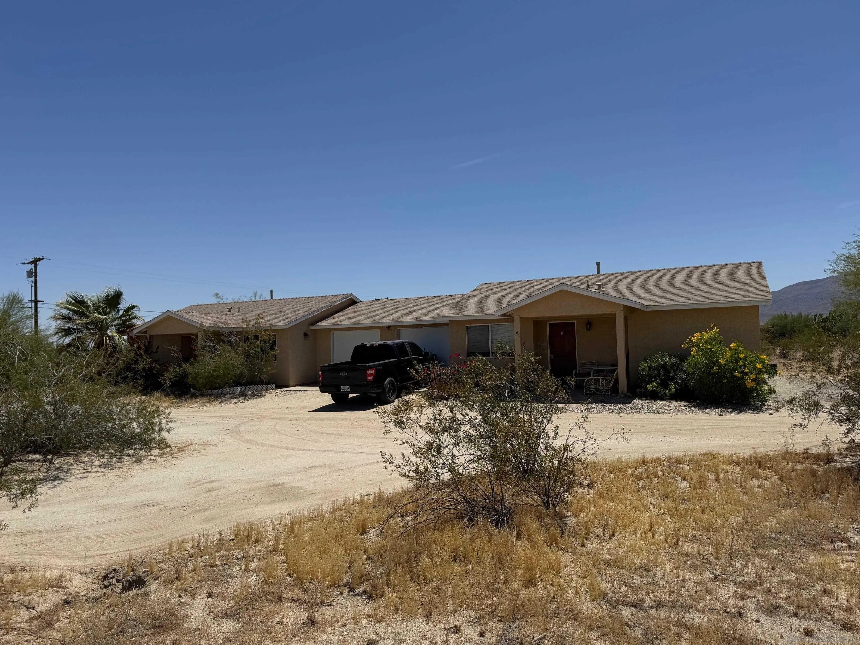 2701 Double O Road Borrego Springs, CA 92004 - Photo 2 of 2 a front view of a house with a yard