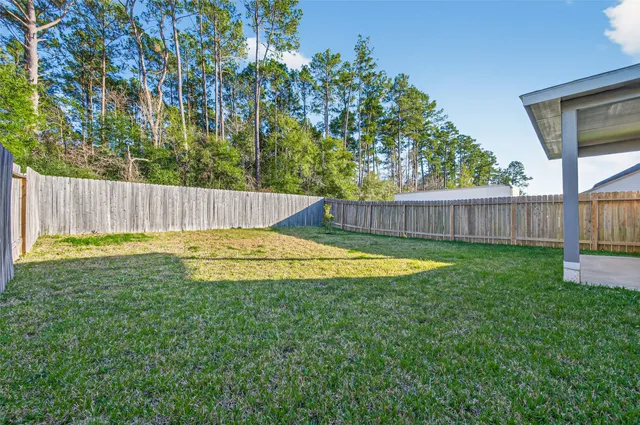 a view of a swimming pool with a backyard