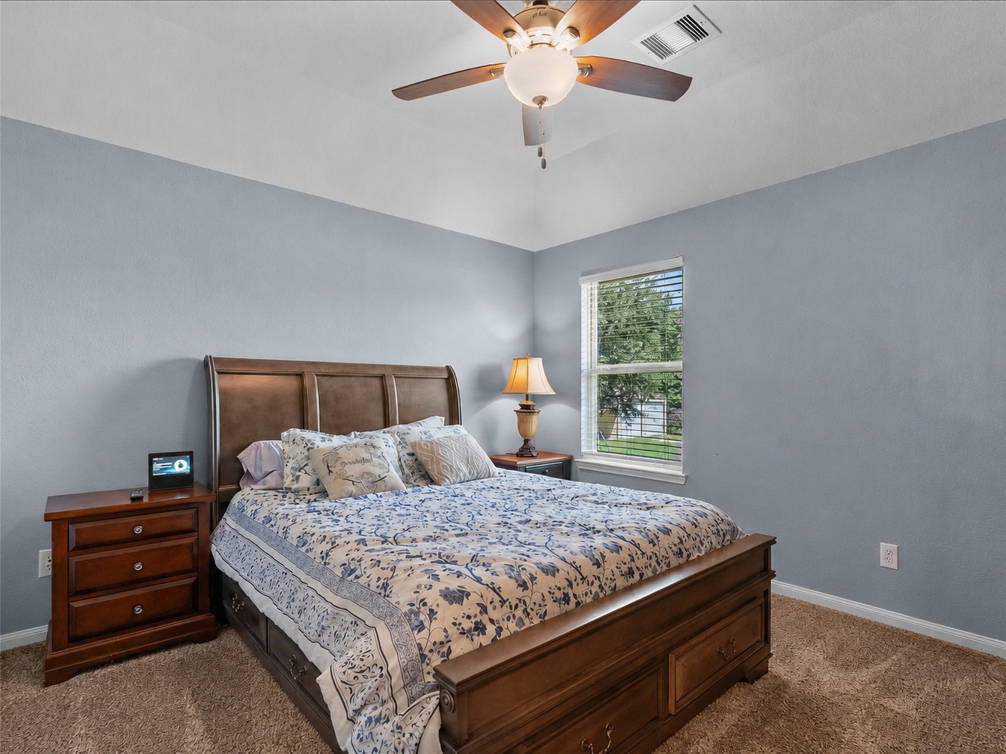 28619 Riverside Crest Lane Huffman, TX 77336 - Photo 33 of 48 Comfortable secondary bedroom with fresh paint, soft carpet and a ceiling fan for added comfort.