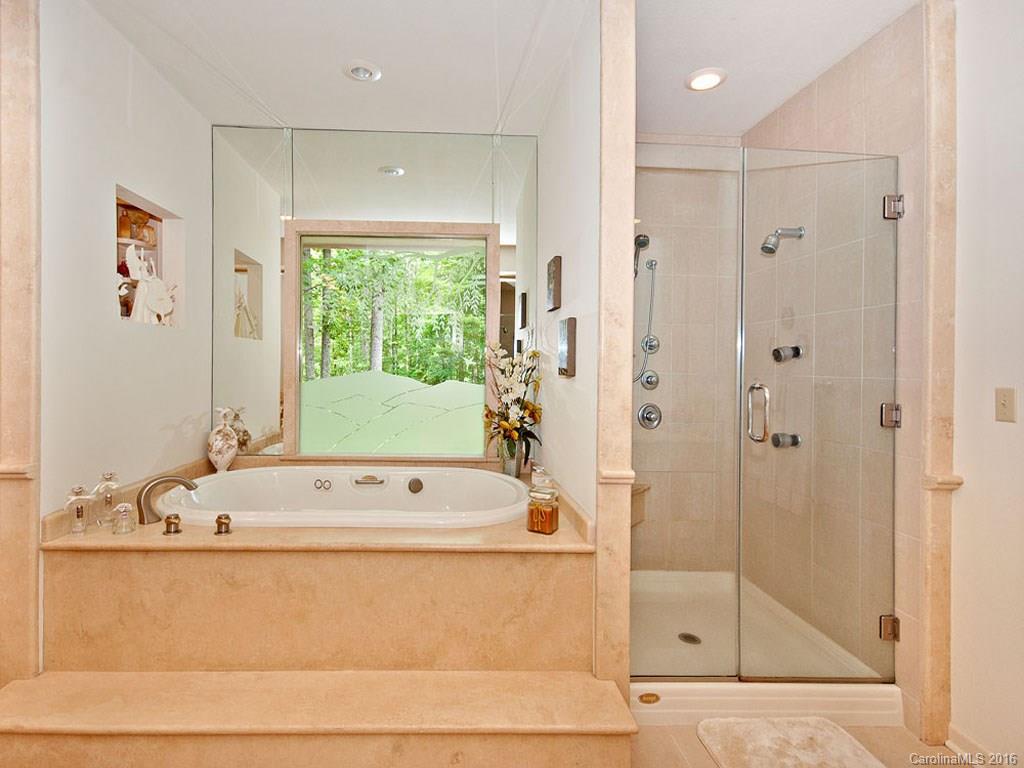 615 Brandywine Road Waynesville, NC 28786 - Photo 13 of 24 a bathroom with a bathtub and a shower