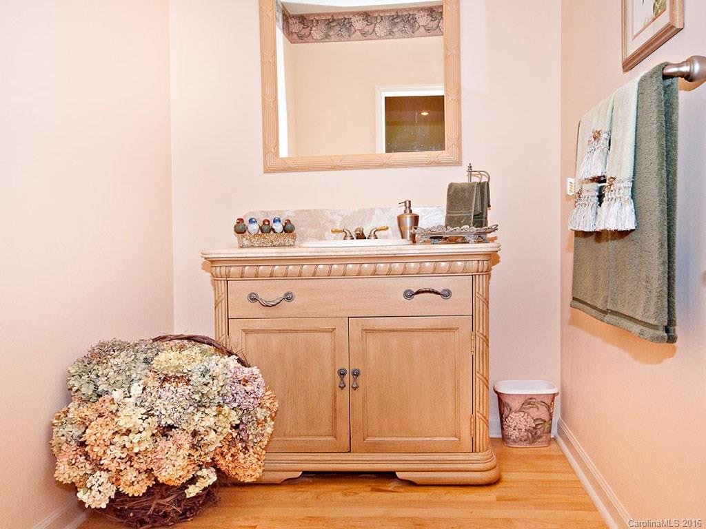 615 Brandywine Road Waynesville, NC 28786 - Photo 15 of 24 a bathroom with a sink and a mirror