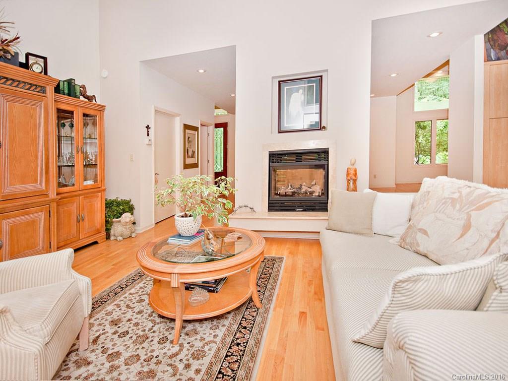 615 Brandywine Road Waynesville, NC 28786 - Photo 3 of 24 a living room with patio furniture and a fireplace