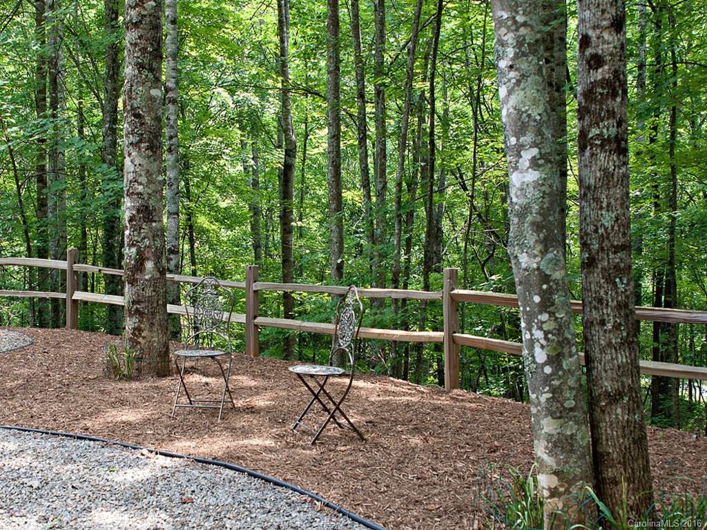 615 Brandywine Road Waynesville, NC 28786 - Photo 21 of 24 a view of a chair and table in the backyard