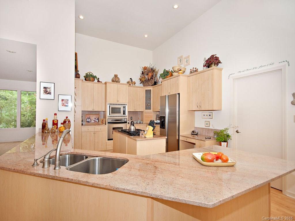 615 Brandywine Road Waynesville, NC 28786 - Photo 5 of 24 a kitchen with sink a stove and refrigerator