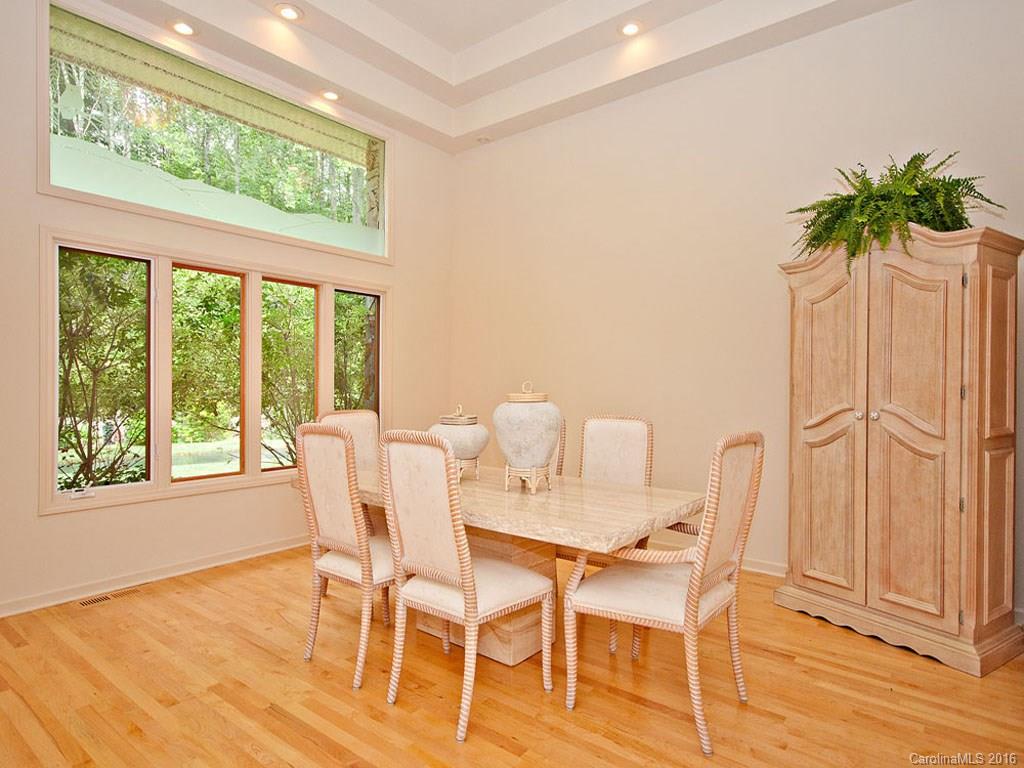 615 Brandywine Road Waynesville, NC 28786 - Photo 8 of 24 a view of a dining room with furniture and a potted plant