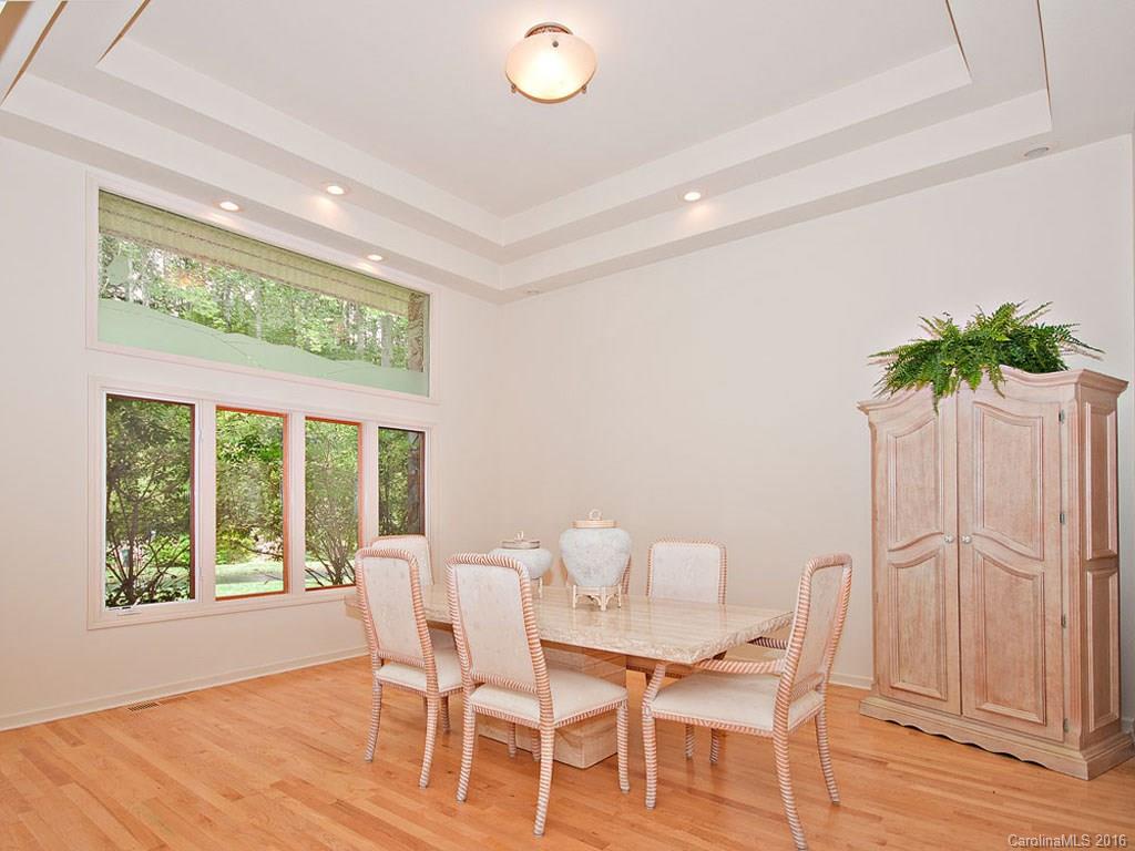 615 Brandywine Road Waynesville, NC 28786 - Photo 9 of 24 a view of a dining room with furniture window and wooden floor