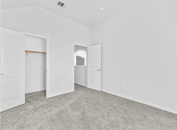a view of a room with wooden floor and window