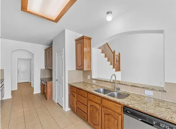 a view of kitchen with furniture and large window