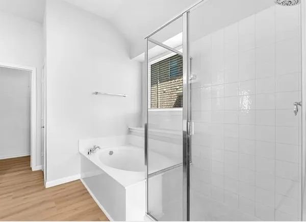 a spacious bathroom with a double vanity sink and a mirror