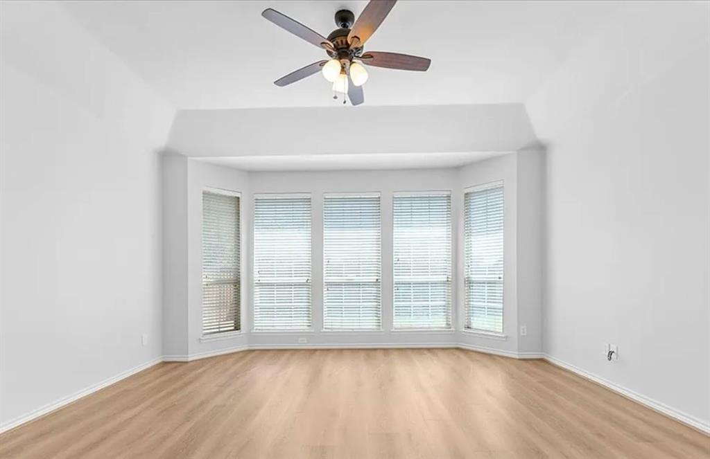 8401 Hitching Trail McKinney, TX 75070 - Photo 36 of 39 Spare room with a ceiling fan and light wood-style flooring