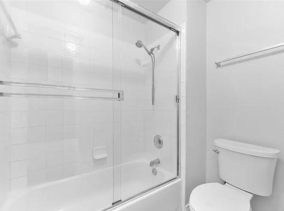 8401 Hitching Trail McKinney, TX 75070 - Photo 5 of 39 Bathroom with toilet and combined bath / shower with glass door