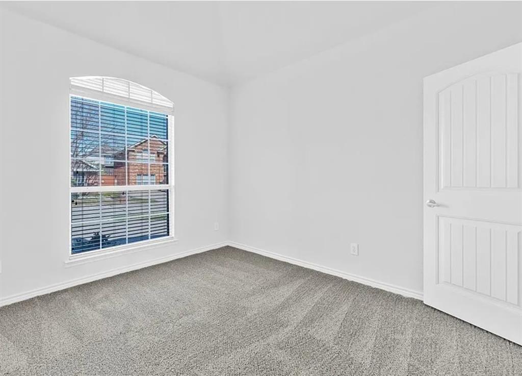 8401 Hitching Trail McKinney, TX 75070 - Photo 8 of 39 Carpeted empty room featuring baseboards
