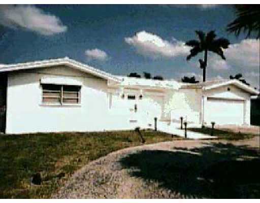 7100 Northeast 8th Drive Boca Raton, FL 33487 - Photo 1 of 2 a view of a house with a backyard