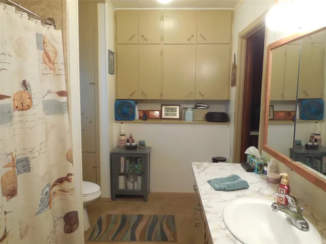 a kitchen with a sink stove and refrigerator