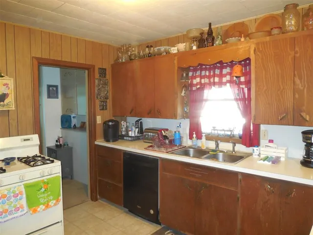 a kitchen with stainless steel appliances granite countertop a stove and a refrigerator