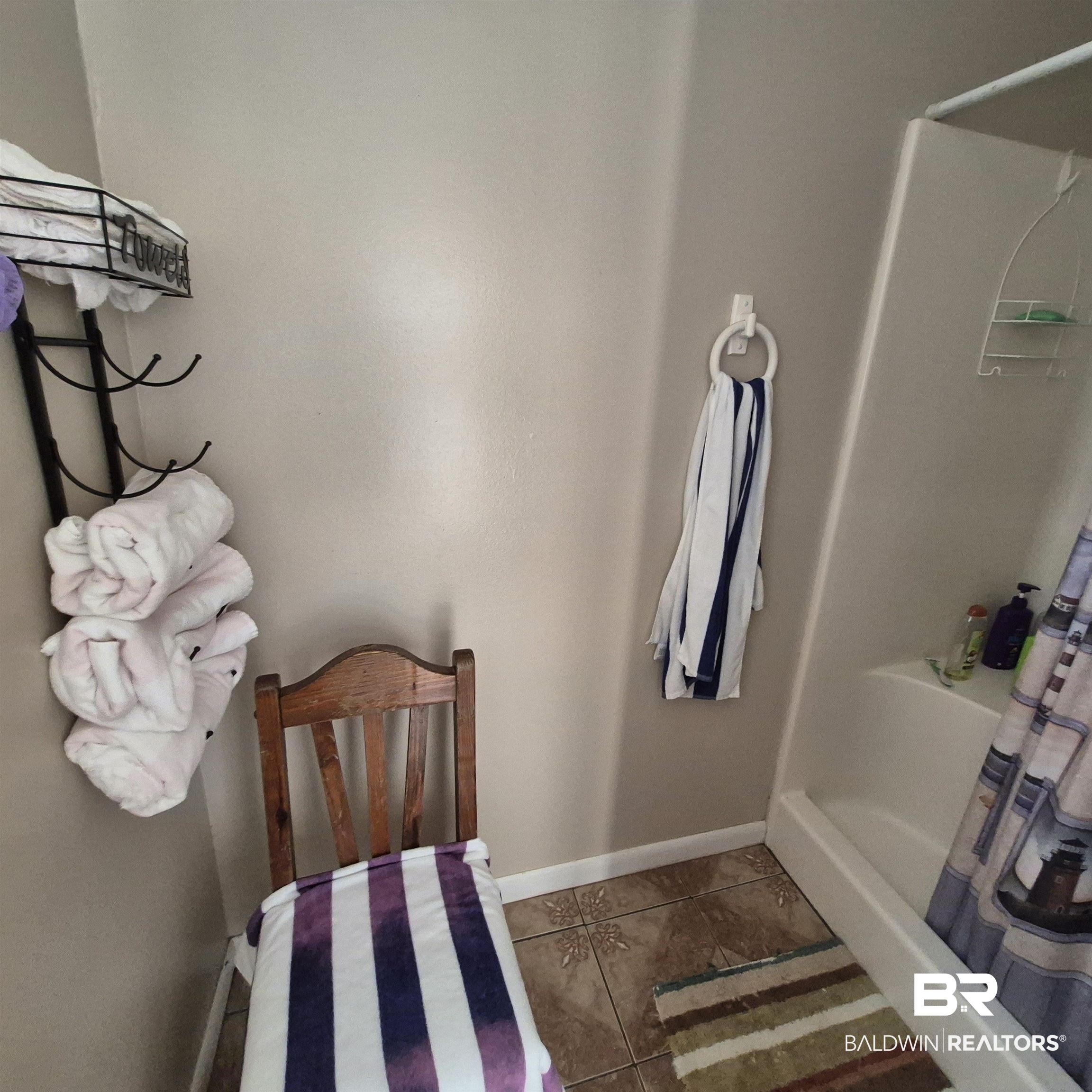 26635 Highway 41 Range, AL 36473 - Photo 39 of 74 Full bath featuring a shower stall and dark tile patterned floors