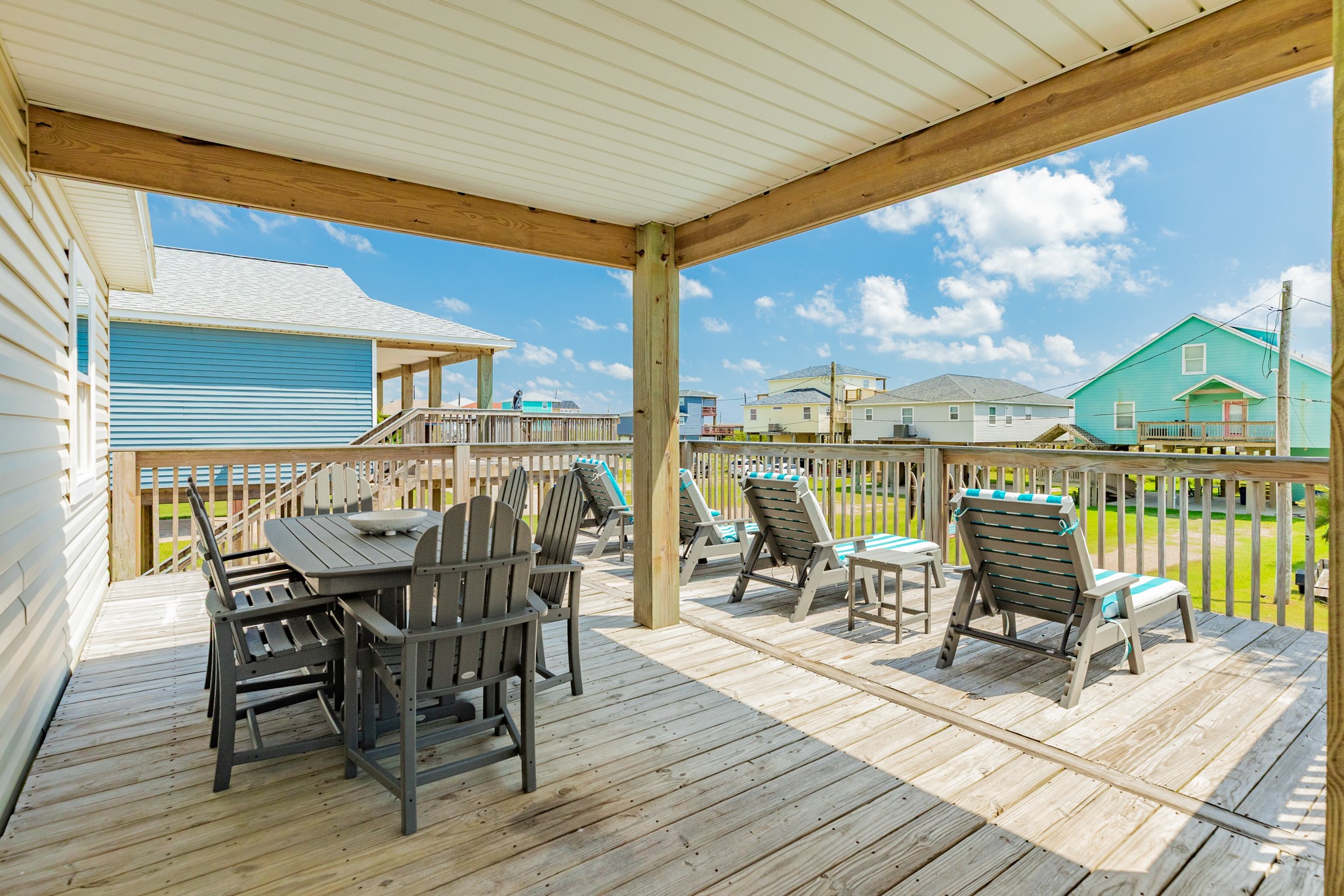 507 Point Lookout Surfside Beach, TX 77541 - Photo 13 of 31 a view of a patio with a table chairs and wooden floor