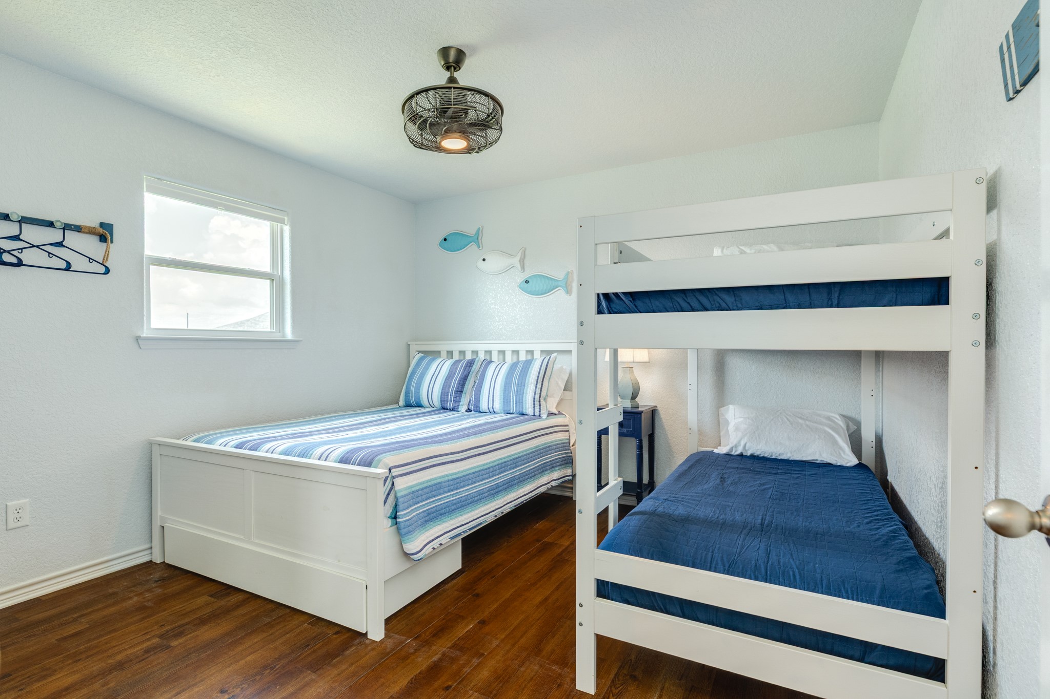 507 Point Lookout Surfside Beach, TX 77541 - Photo 20 of 31 a bedroom with a bed and a chandelier