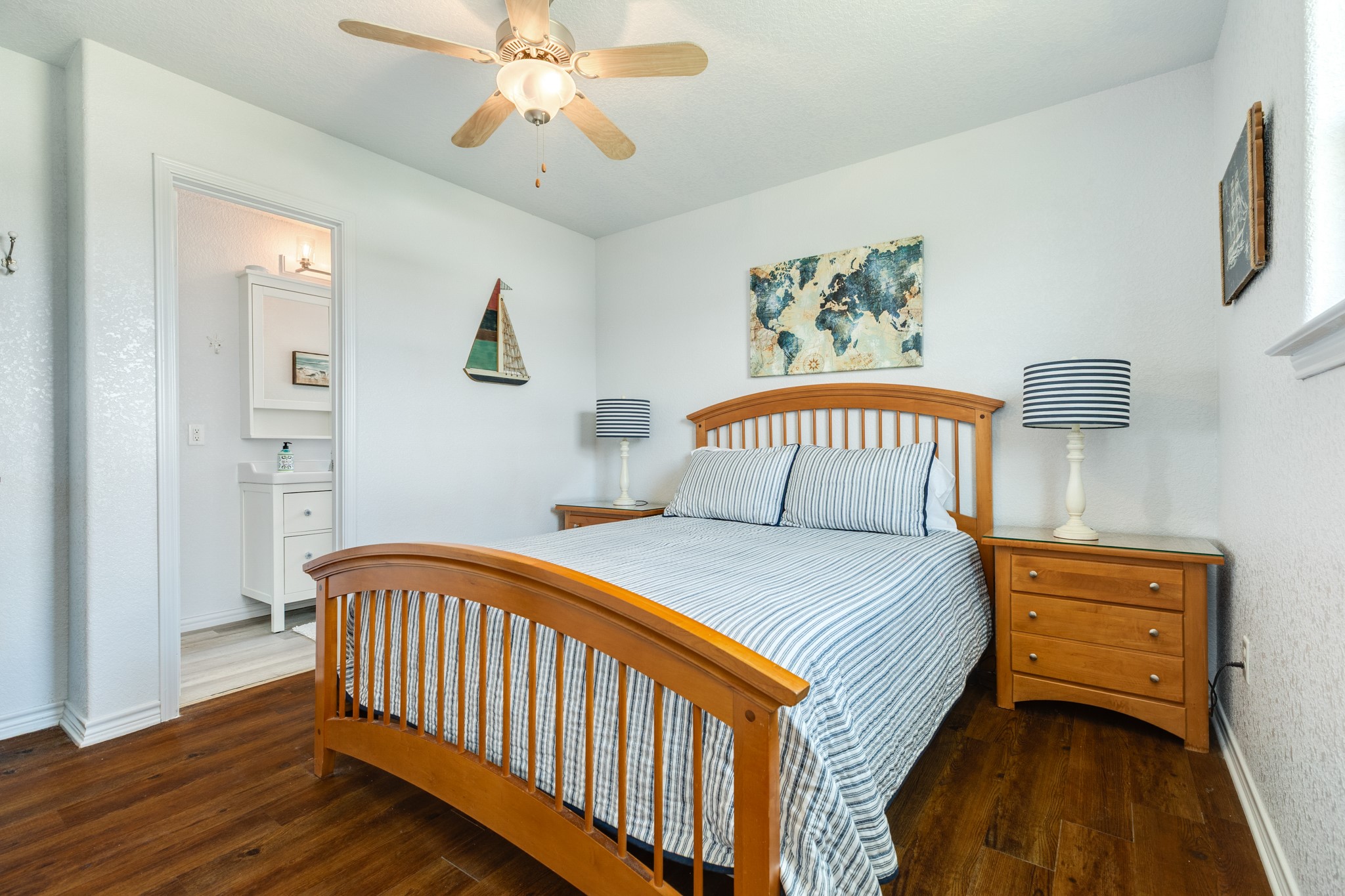 507 Point Lookout Surfside Beach, TX 77541 - Photo 23 of 31 a bedroom with a bed and a chandelier