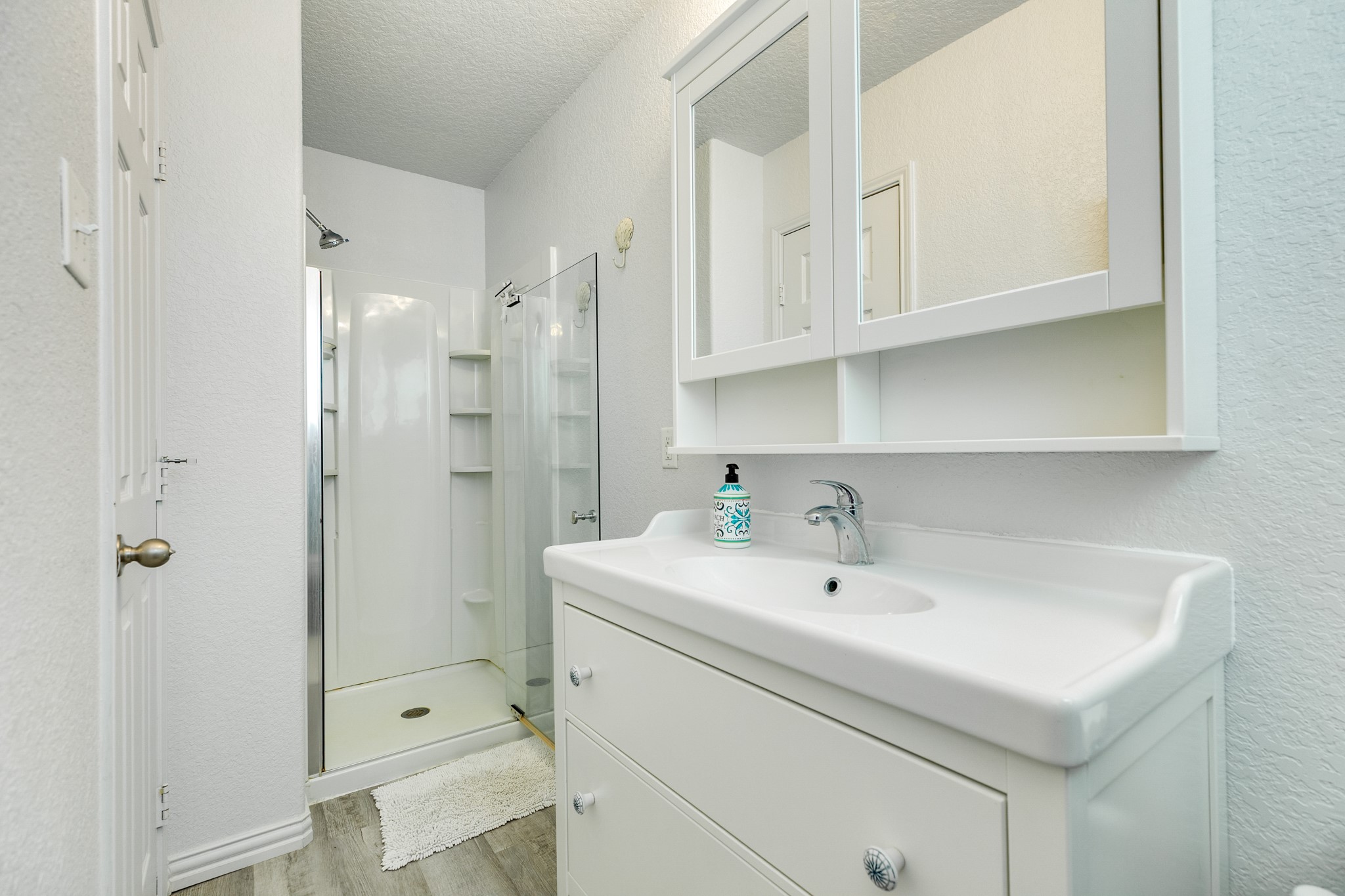507 Point Lookout Surfside Beach, TX 77541 - Photo 24 of 31 a bathroom with a sink a shower and a mirror