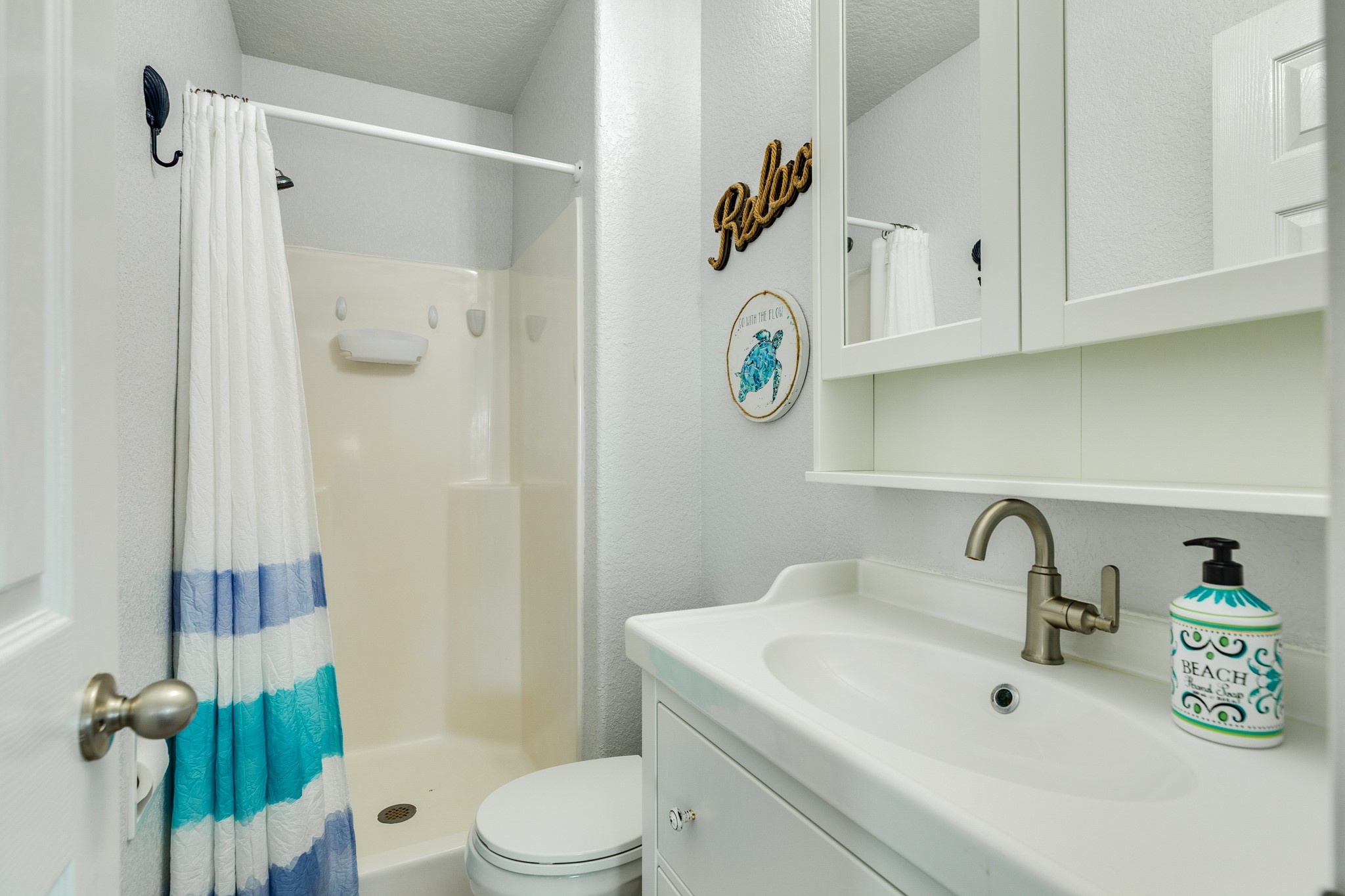 507 Point Lookout Surfside Beach, TX 77541 - Photo 25 of 31 a bathroom with a sink a toilet and shower
