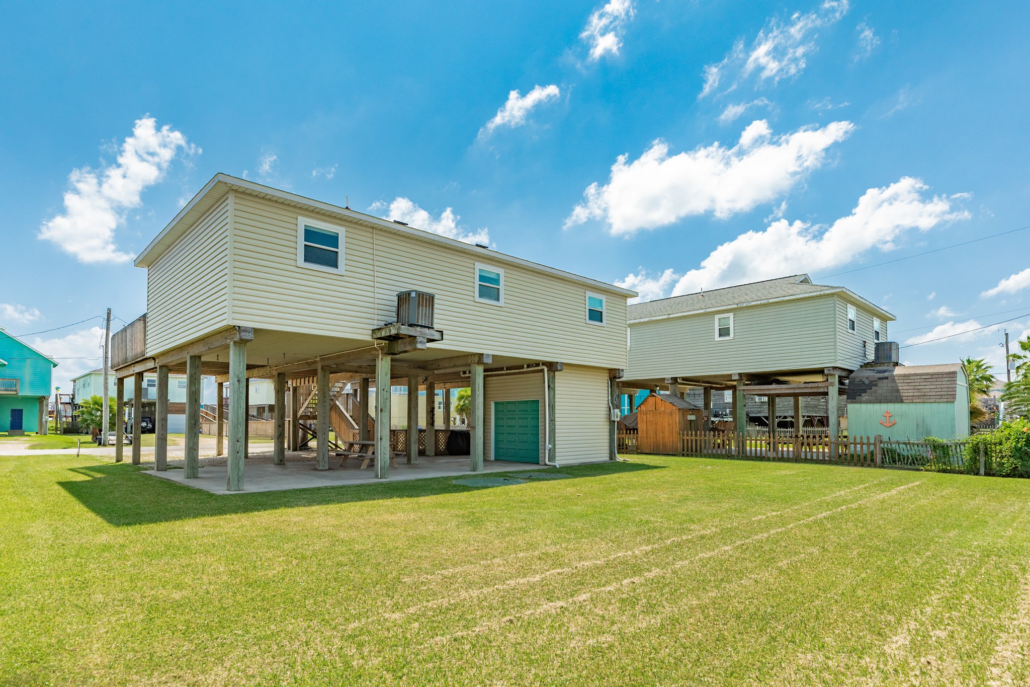 507 Point Lookout Surfside Beach, TX 77541 - Photo 31 of 31 a front view of house with yard and garage