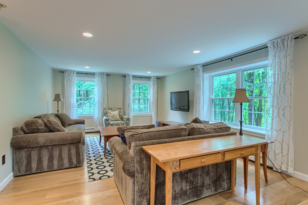 104 Sampson Road Bolton, MA 01740 - Photo 15 of 30 a bed sitting in a spacious bedroom next to a window