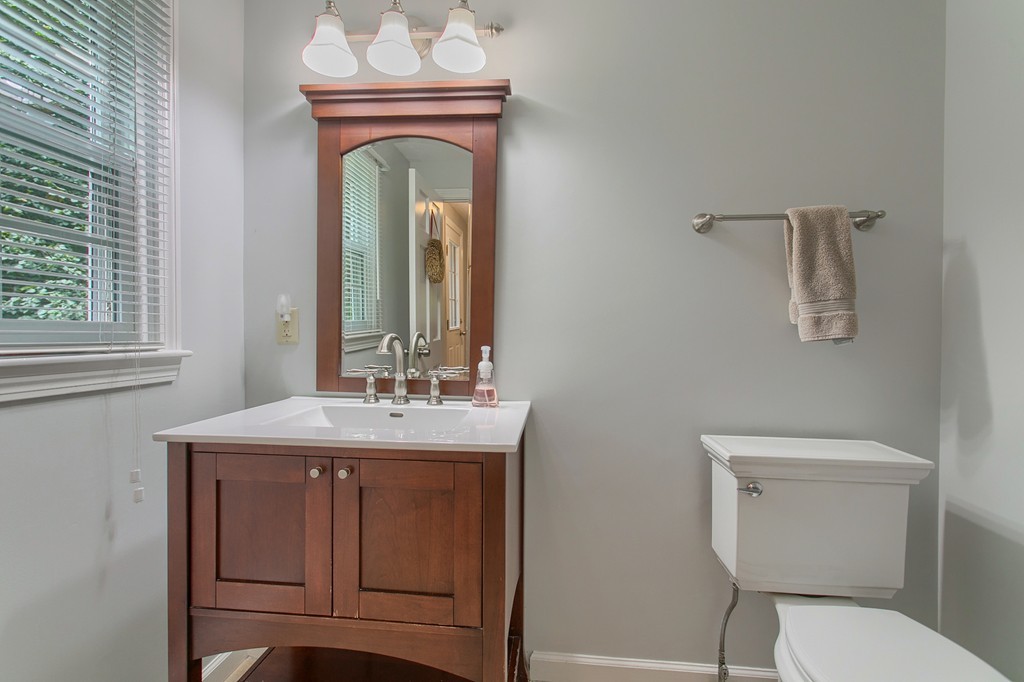 104 Sampson Road Bolton, MA 01740 - Photo 16 of 30 a bathroom with a toilet sink and mirror