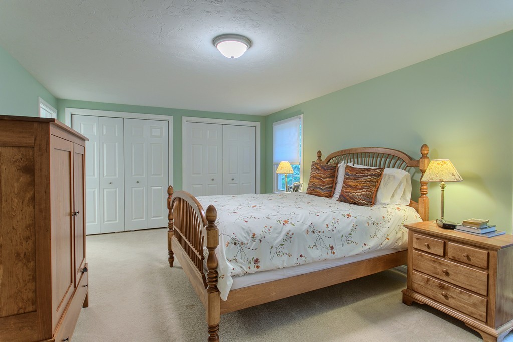 104 Sampson Road Bolton, MA 01740 - Photo 18 of 30 a bedroom with a bed and a dresser