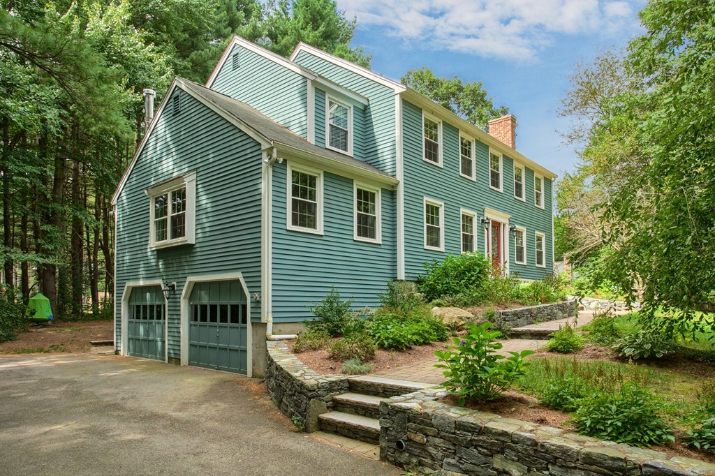 104 Sampson Road Bolton, MA 01740 - Photo 2 of 30 a view of a house with a yard and potted plants