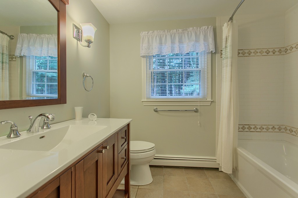 104 Sampson Road Bolton, MA 01740 - Photo 24 of 30 a bathroom with a sink a toilet and shower