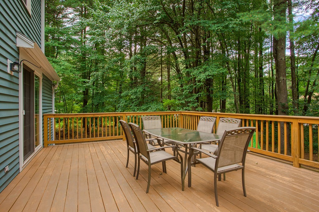 104 Sampson Road Bolton, MA 01740 - Photo 27 of 30 a view of a wooden deck with furniture