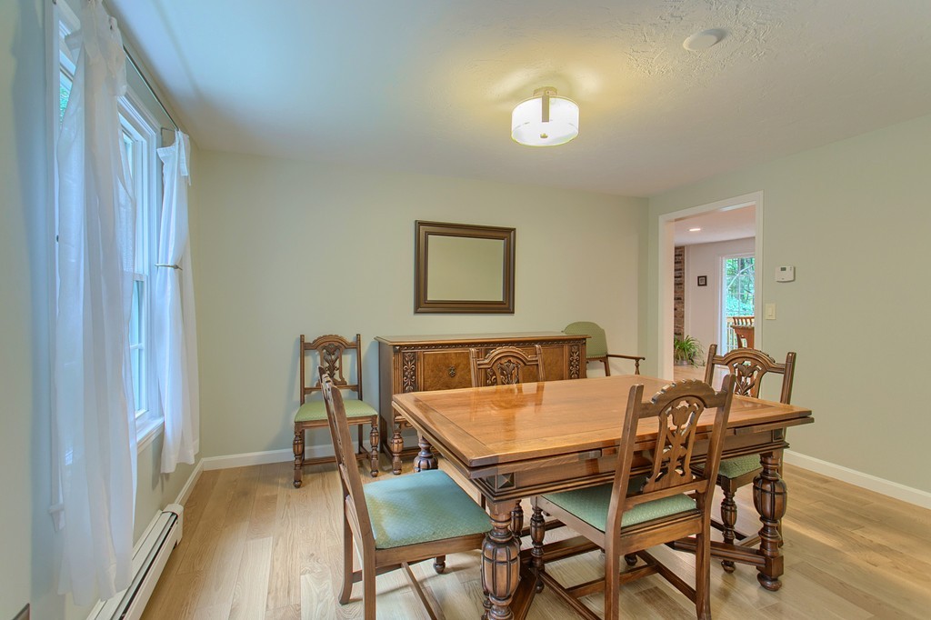 104 Sampson Road Bolton, MA 01740 - Photo 9 of 30 a view of a dining room with furniture and wooden floor