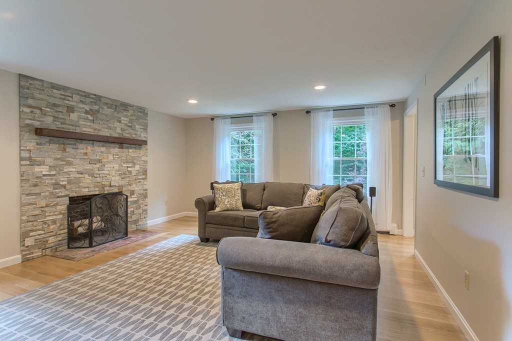 104 Sampson Road Bolton, MA 01740 - Photo 10 of 30 a living room with furniture and a fireplace