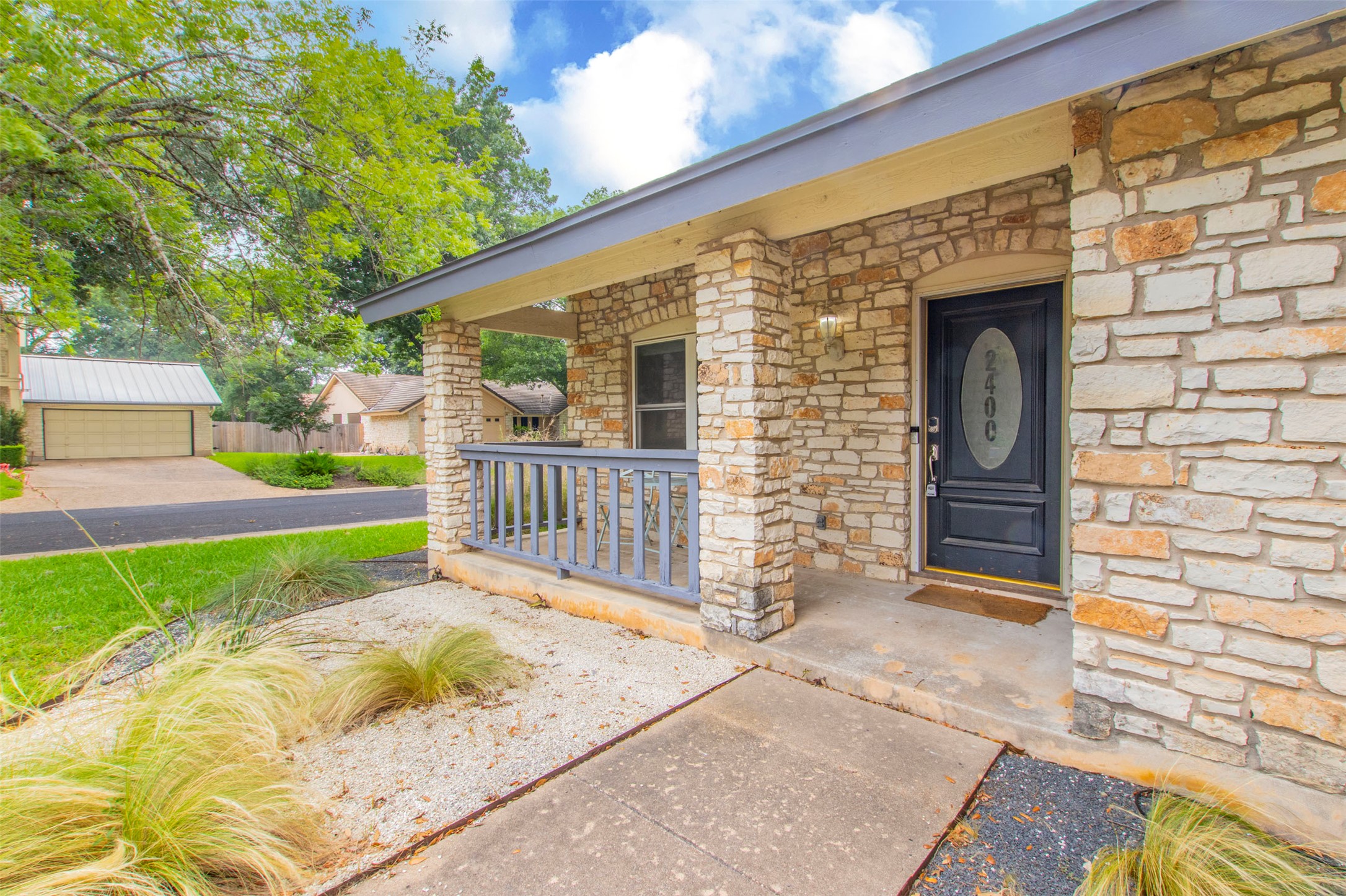 2400 Braemar Cove Austin, TX 78747 - Photo 2 of 20 a view of a house with a small yard and wooden fence