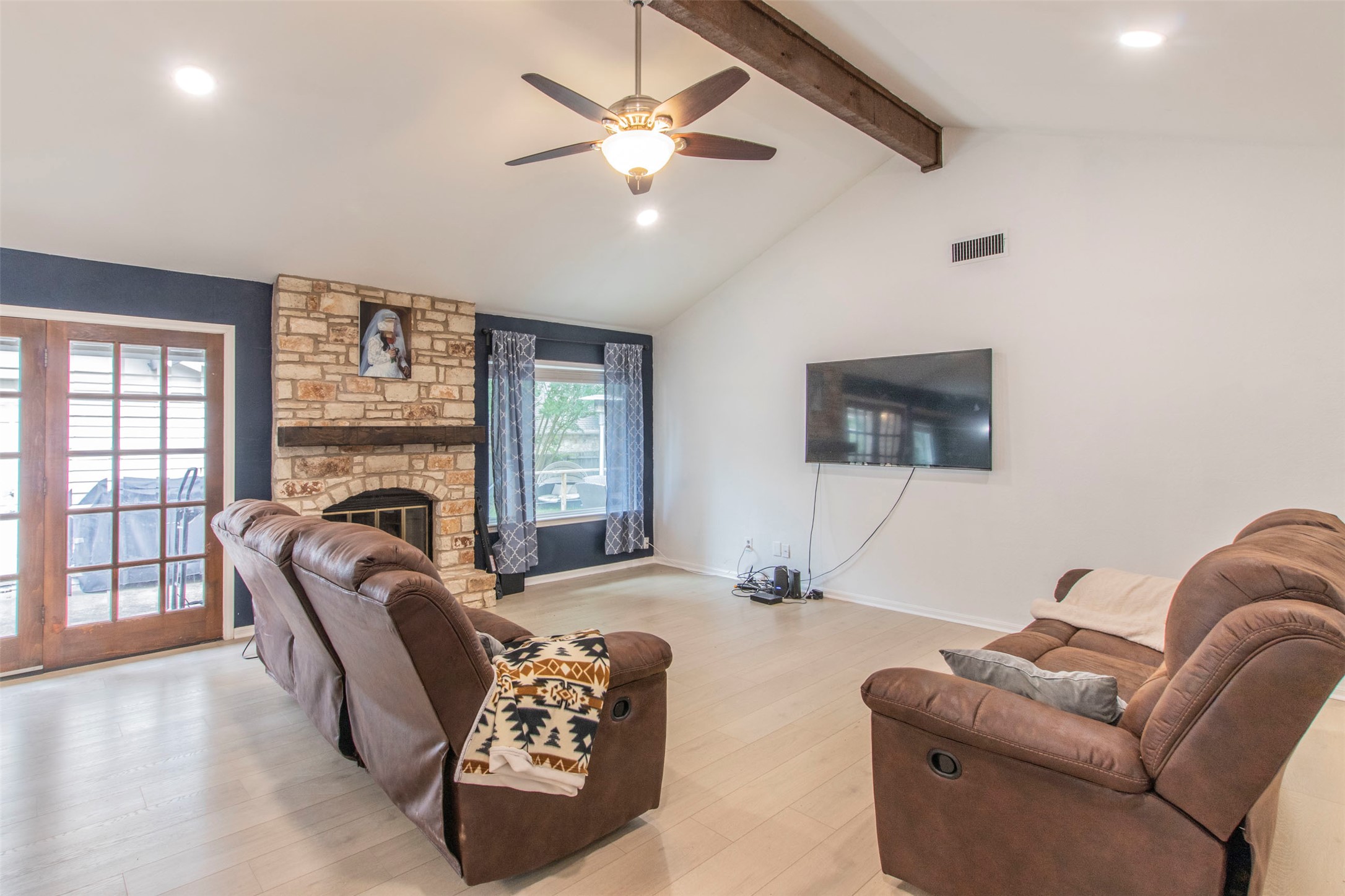 2400 Braemar Cove Austin, TX 78747 - Photo 9 of 20 a living room with furniture fireplace and a large window