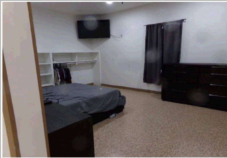 3349 Fm 2652 Graham, TX 76450 - Photo 6 of 12 a bedroom with a bed and a flat tv screen