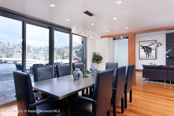 a view of a dining room with furniture window and wooden floor