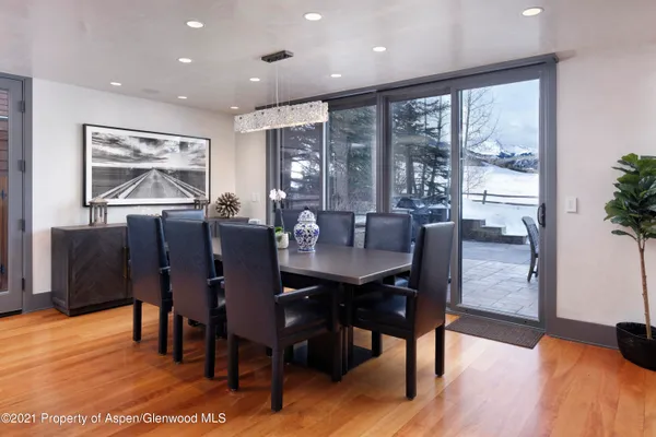 a view of a dining room with furniture window and wooden floor