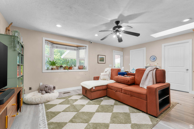 1489 North 400 West Bountiful, UT 84010 - Photo 11 of 47 Living area featuring a bay window, recessed lighting, and a ceiling fan
