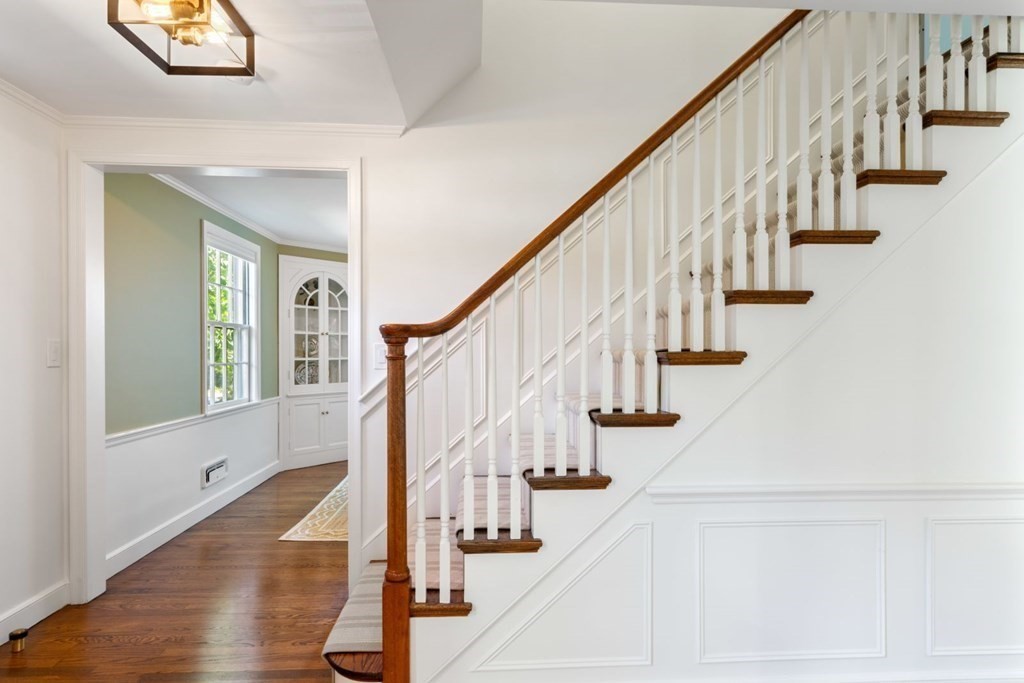 110 Suffolk Road Wellesley, MA 02481 - Photo 4 of 29 a view of entryway with wooden floor and stairs