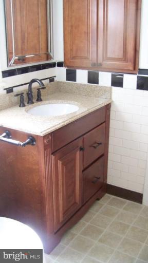 9225 Belair Road Nottingham, MD 21236 - Photo 11 of 21 a kitchen with a sink and cabinets