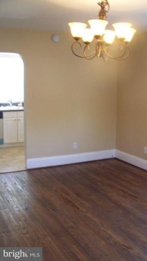 9225 Belair Road Nottingham, MD 21236 - Photo 13 of 21 a view of a room with wooden floor and a window