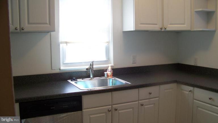 9225 Belair Road Nottingham, MD 21236 - Photo 5 of 21 a kitchen with a sink and cabinets