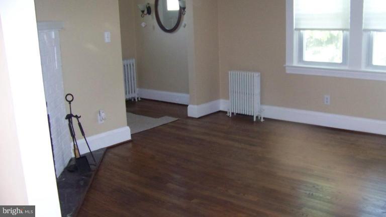 9225 Belair Road Nottingham, MD 21236 - Photo 7 of 21 a bedroom with a bed and a window