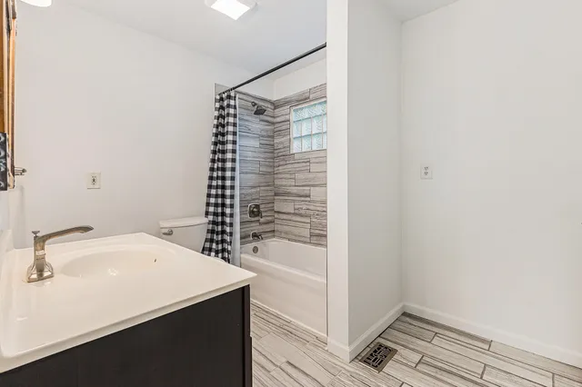 a bathroom with a sink and a shower